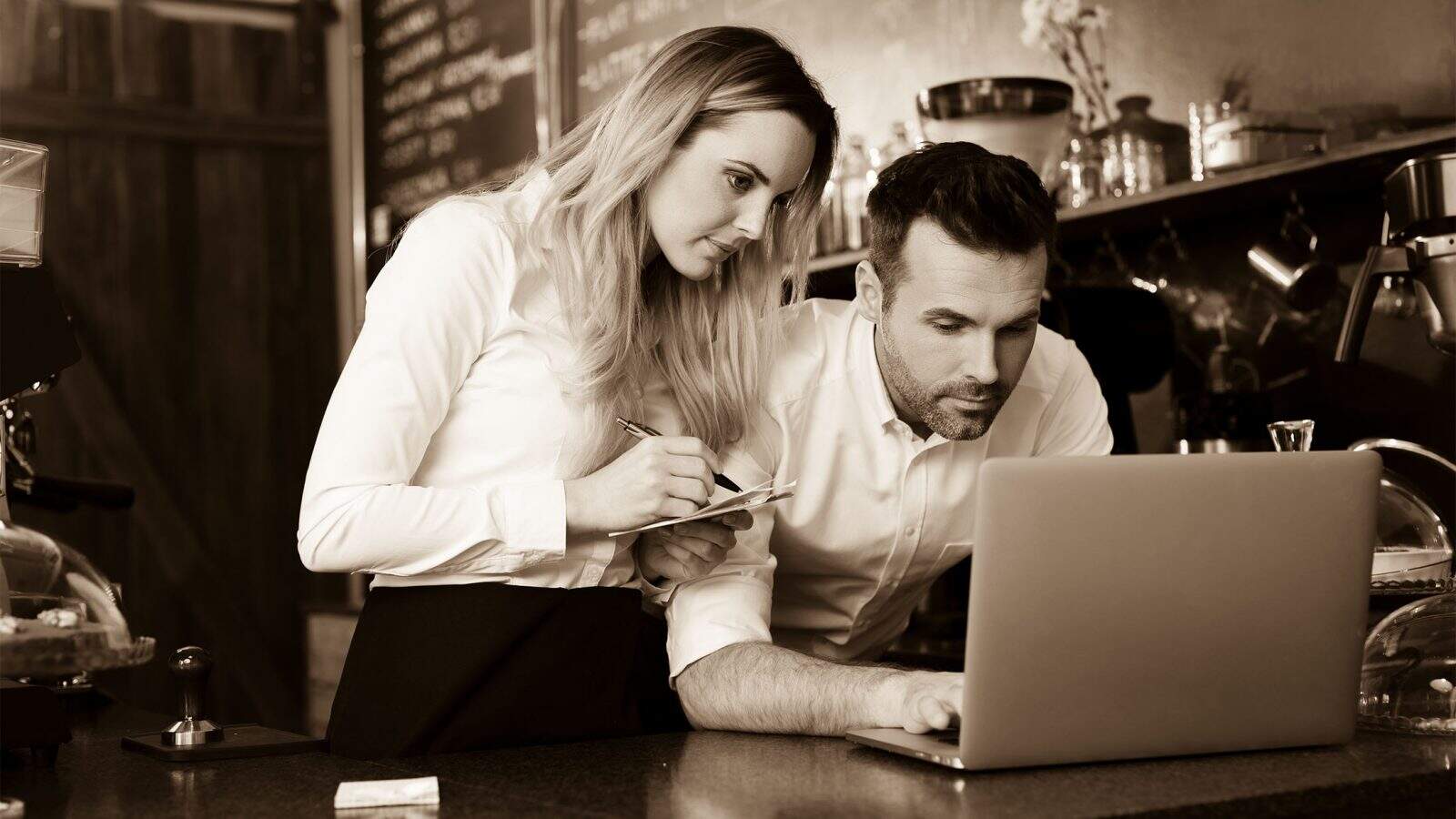 Restaurant leadership coaching session reviewing kitchen operations and team workflow